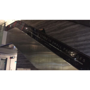 Sticker installation at the escalator